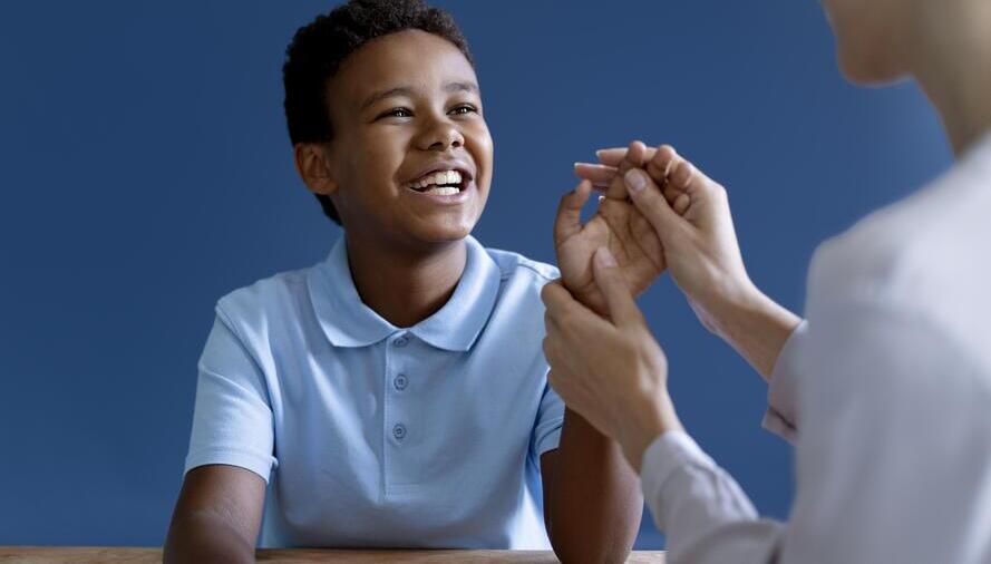 boy-doing-occupational-therapy-session-with-psychologist (1)