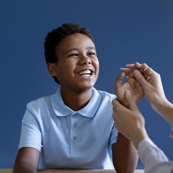 boy doing occupational therapy session with psychologist 1 Paediatric Surgery
